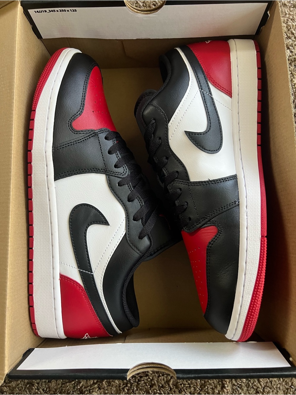 Jordan Men's Low-Top 1 Sneakers in Black, White & Red.